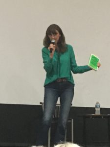 Jen Sincero giving a talk