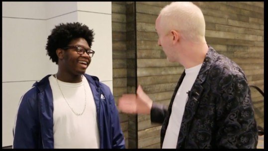 Jamie talks with a young guy at the mall